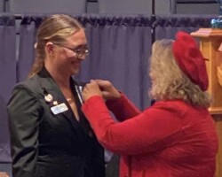 Former Regent passing on the Regents pin